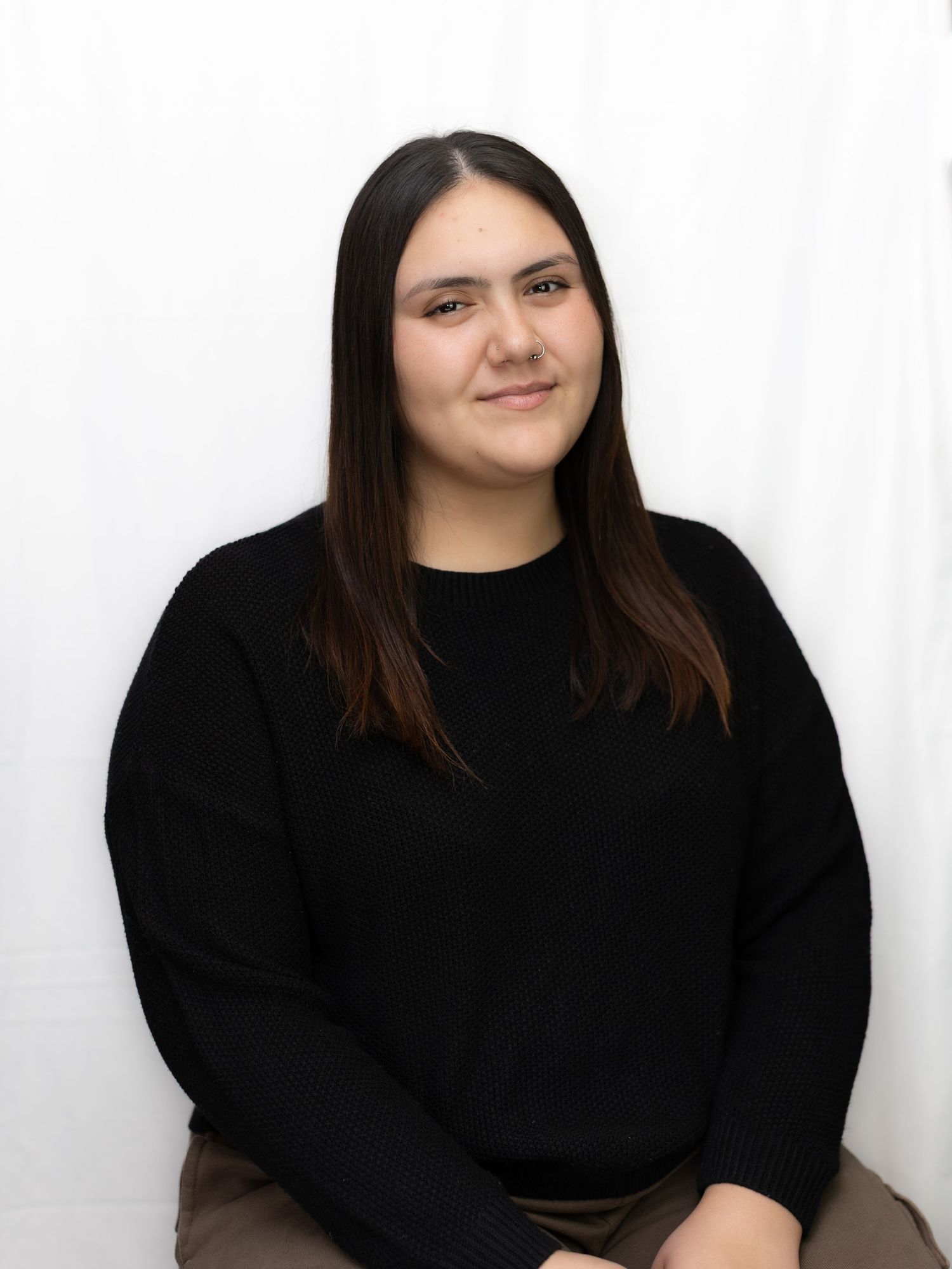 Professional headshots against white background in black attire.