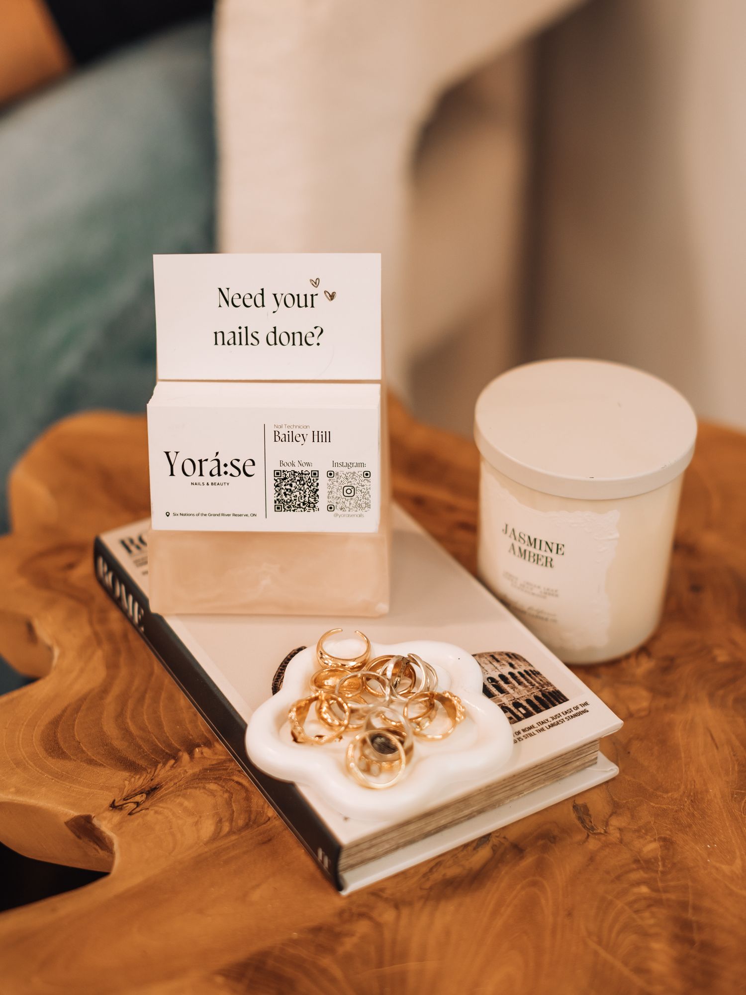 Marketing materials and business cards arranged on a rustic wooden surface.