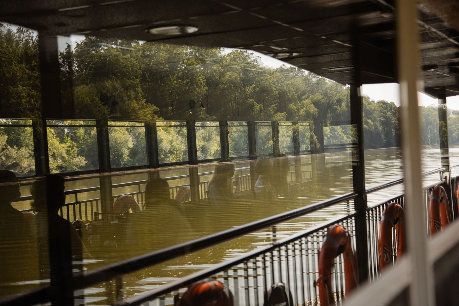 Panoramic view of a river from the deck of a riverboat.