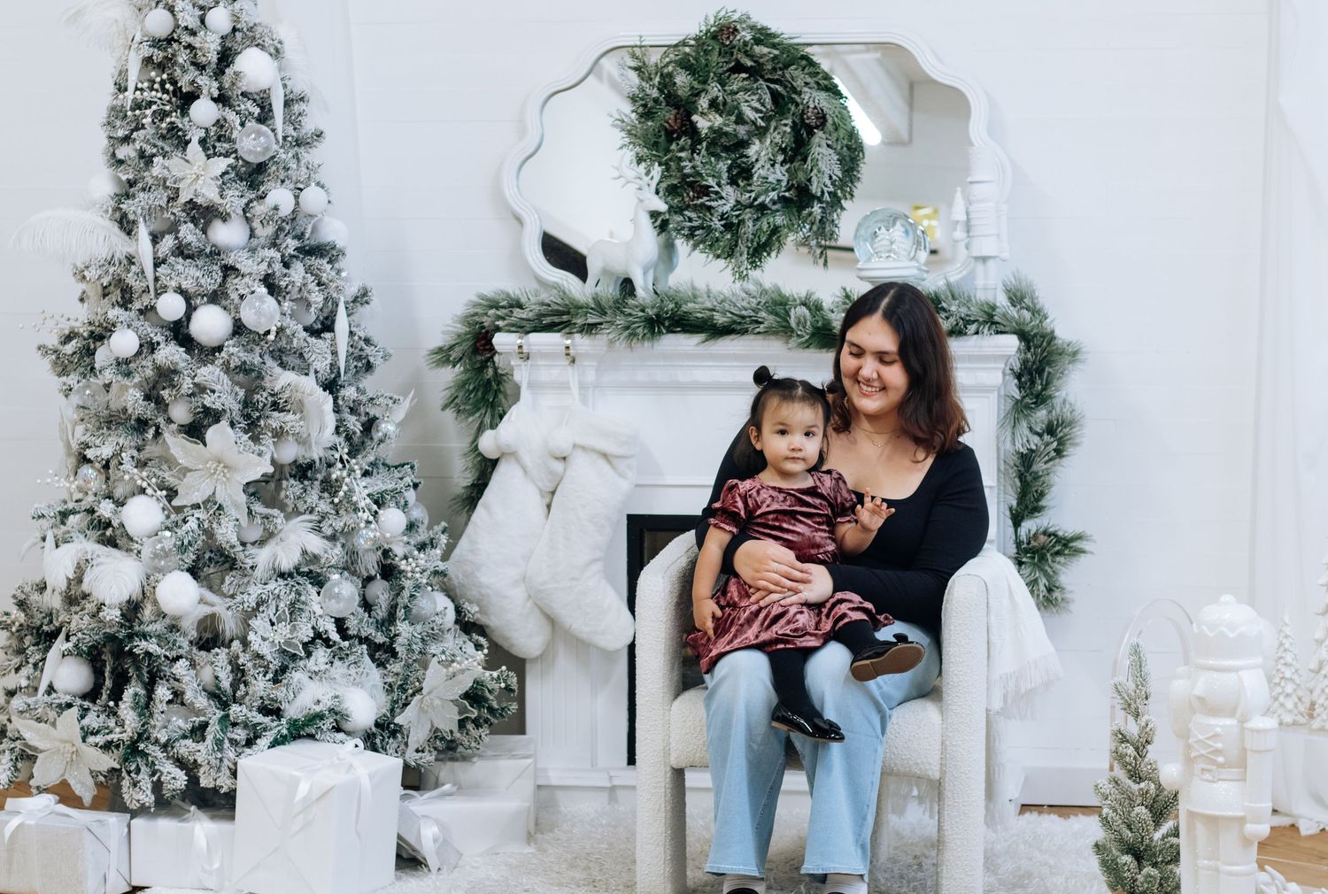 Winter holiday scene with decorated Christmas tree and white wrapped presents.