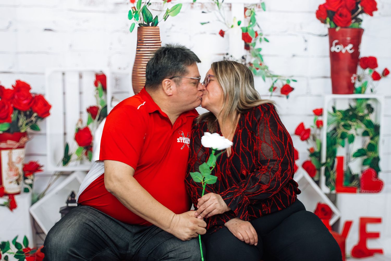 Valentine's day photo collection showing couple's romantic moments against decorated backdrop.