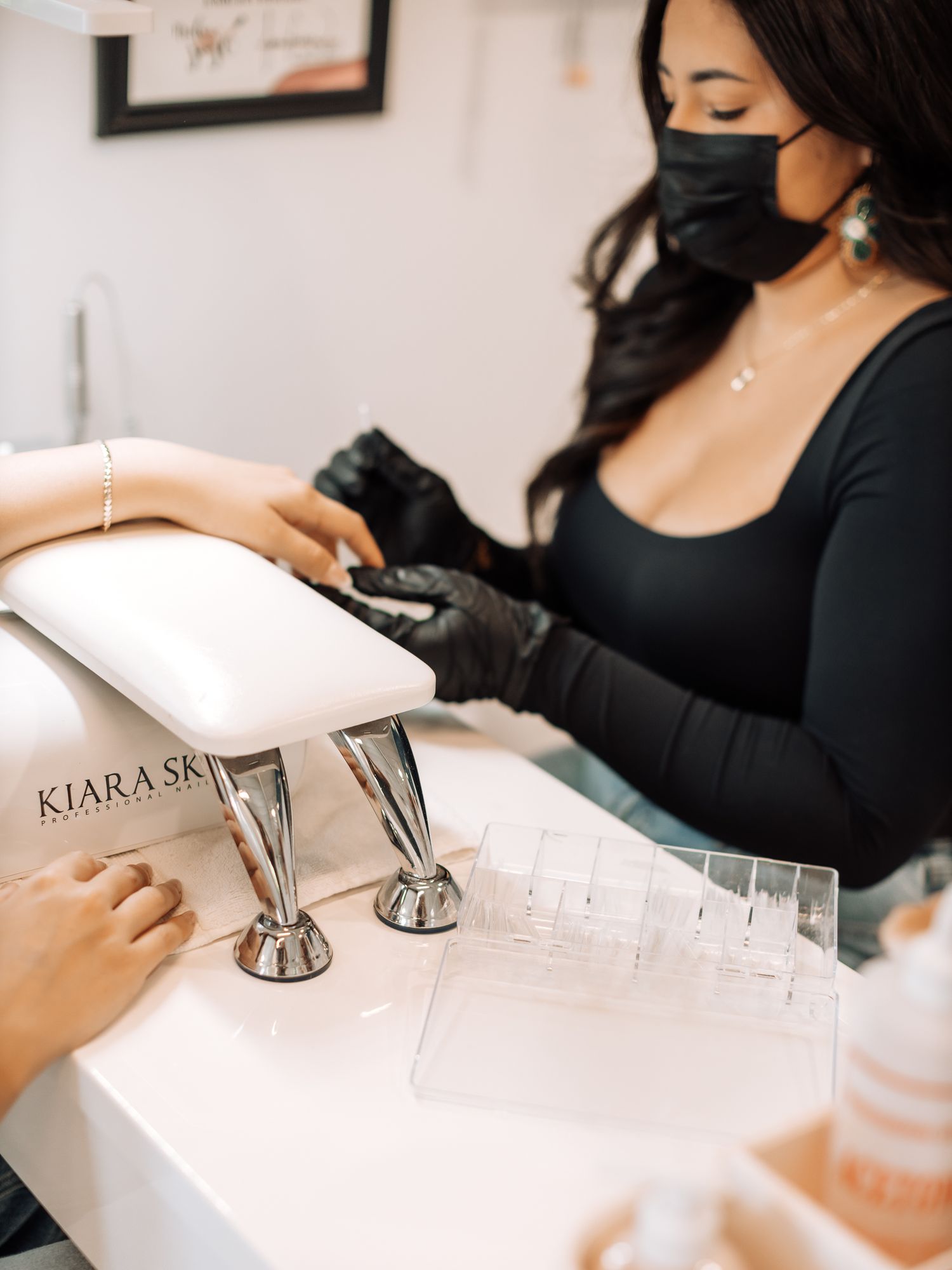 Close up view of a nail service station with tools and equipment.