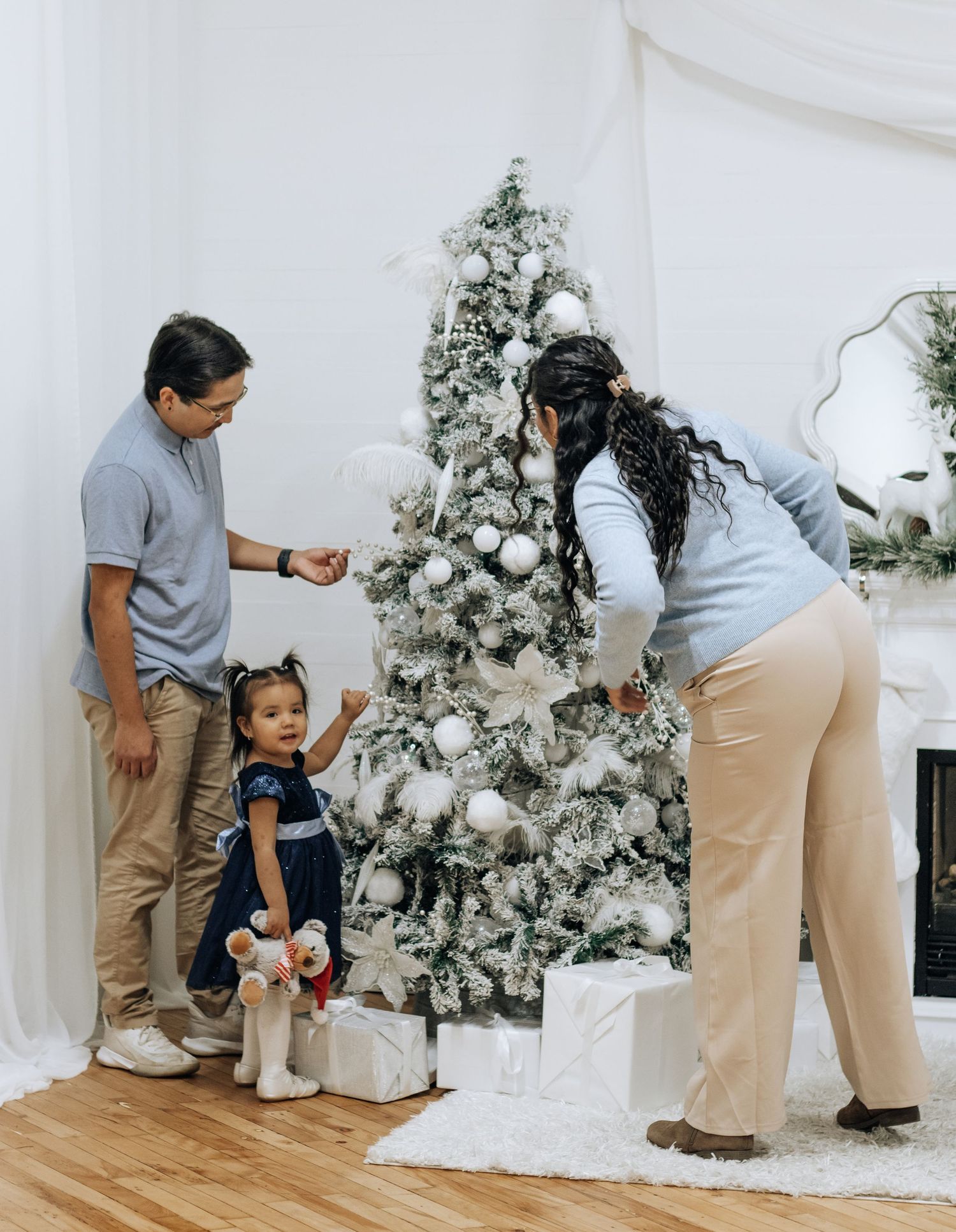 Dynamic sequence of playful poses during a holiday photoshoot with decorated Christmas trees.