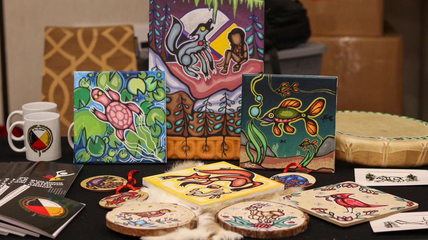 Colorful array of decorated cookies and artistic designs displayed on a table.