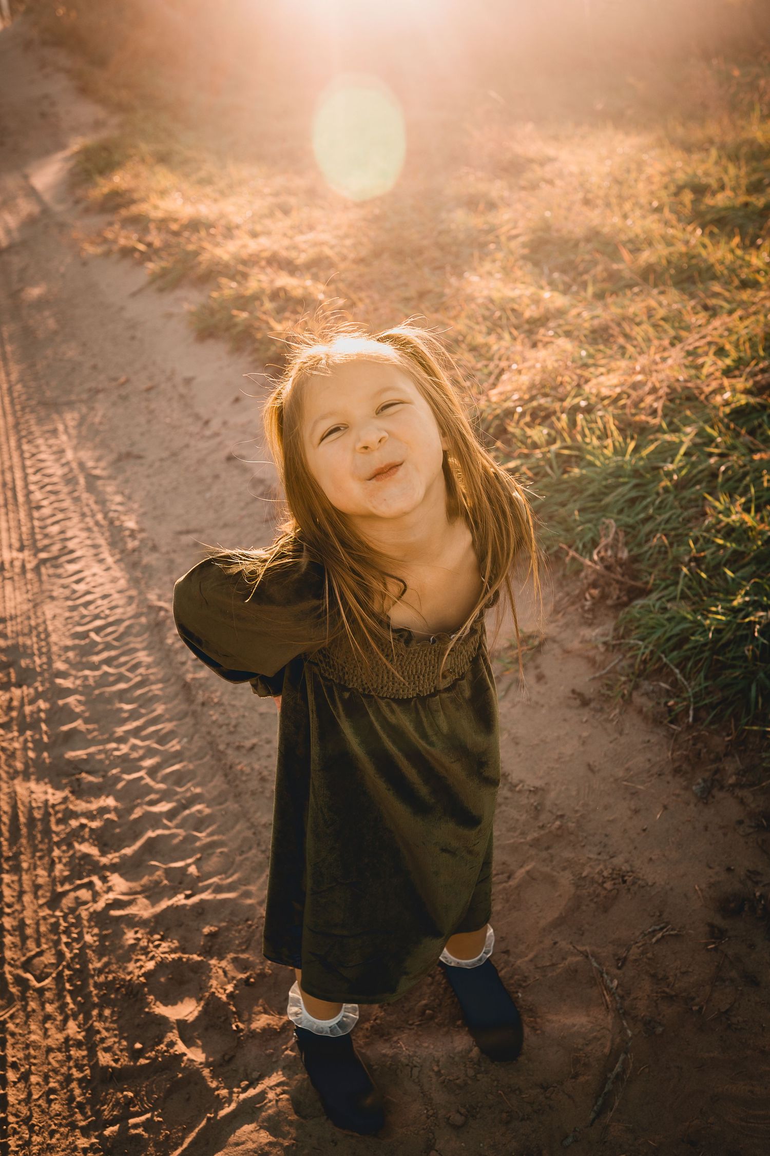 A series of playful poses captured at sunset on a dirt path.