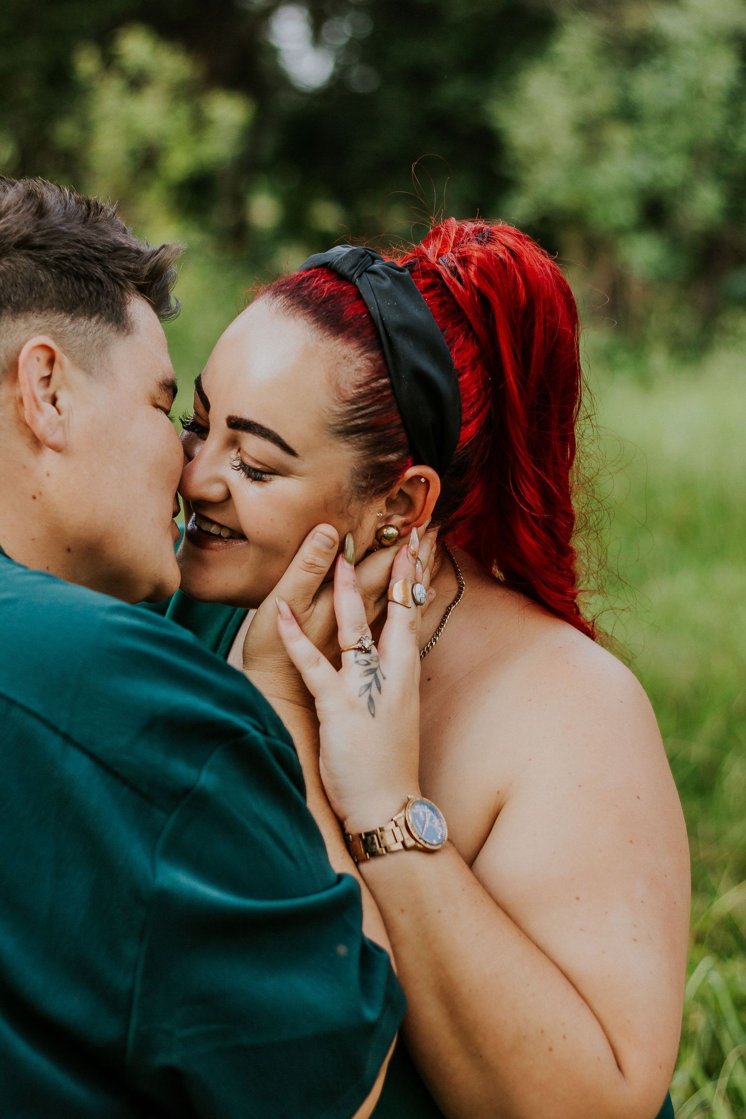 Close-up portrait of a happy couple sharing an intimate, smiling moment together.