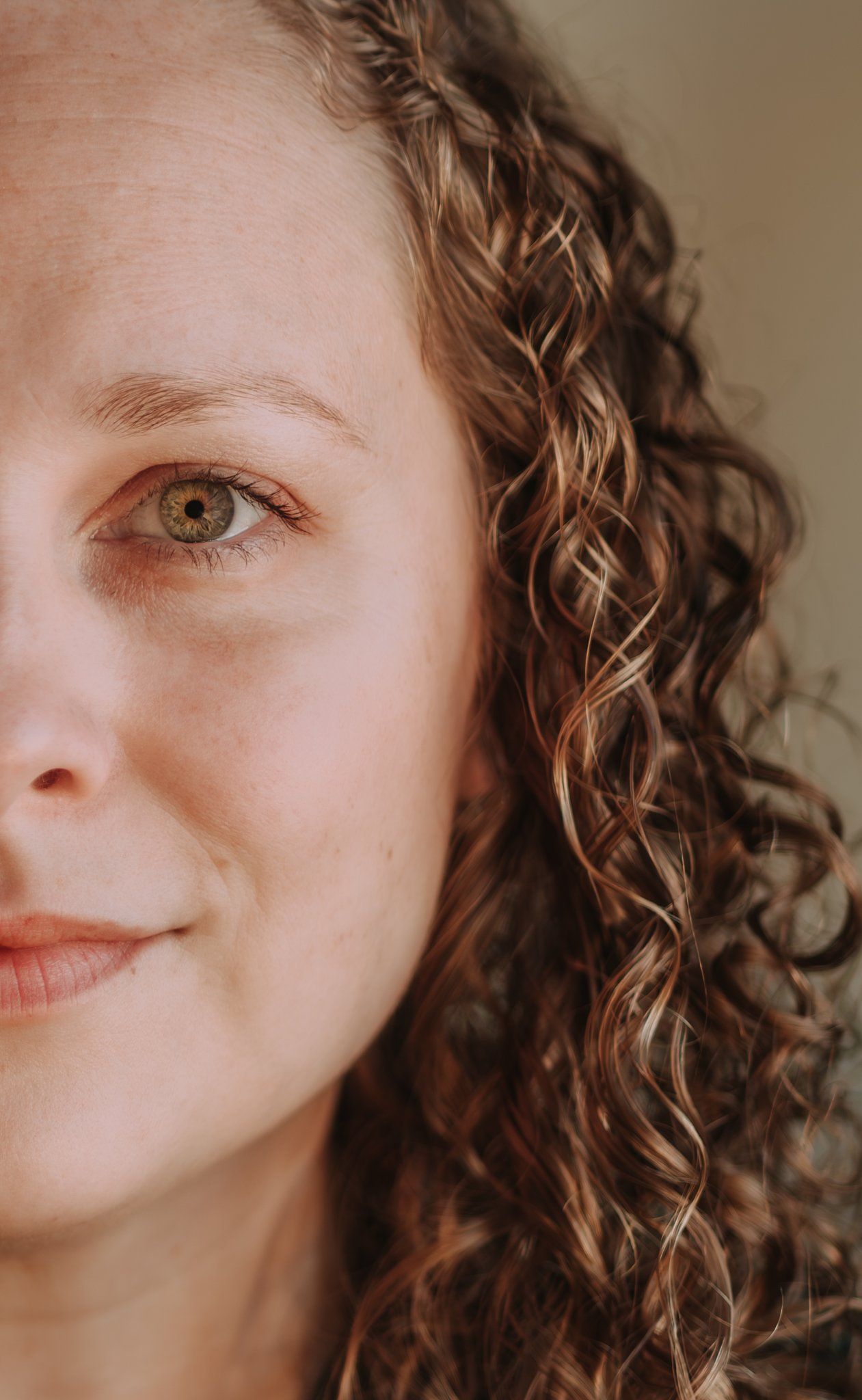 Close-up beauty shots highlighting natural curly hair and soft expressions.