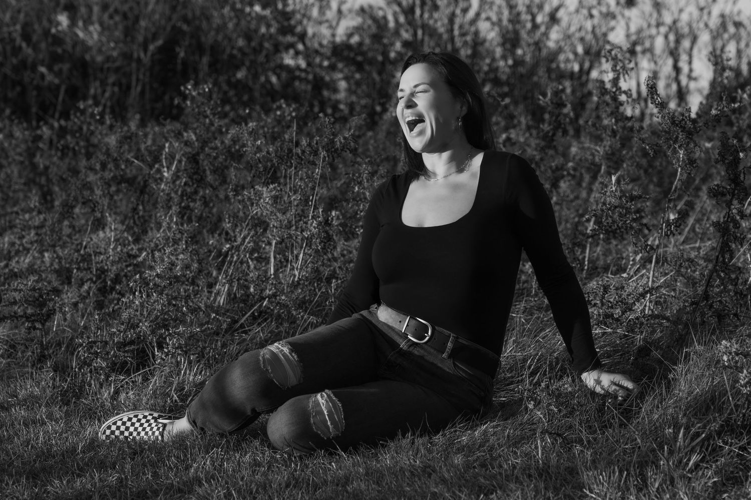 Black and white artistic portrait series showing dramatic expressions in an outdoor setting.