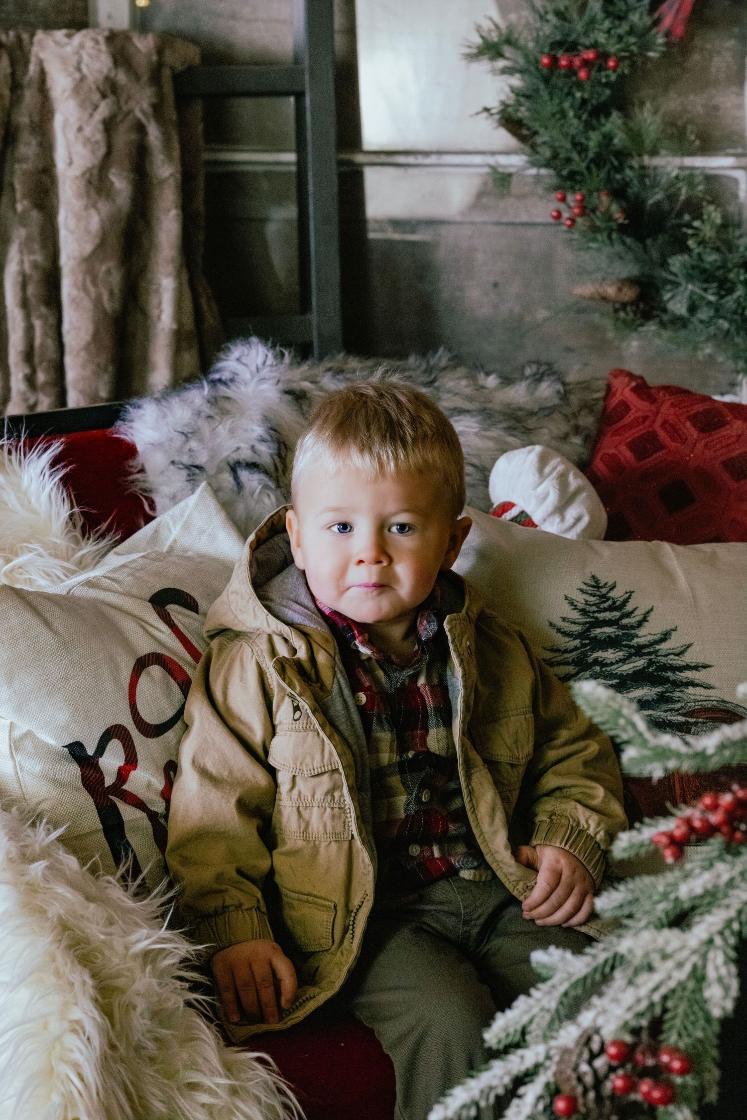 Holiday scene with evergreen decorations and red accents in vintage-style setting.