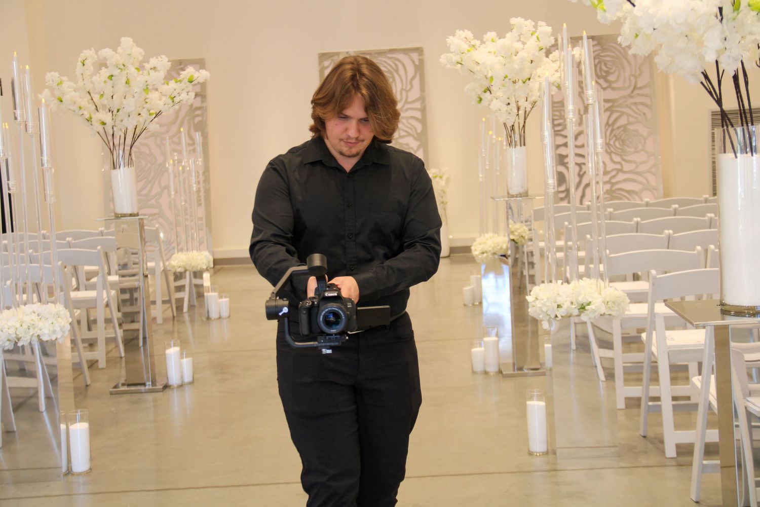 A photo of a videographer taking a shoot