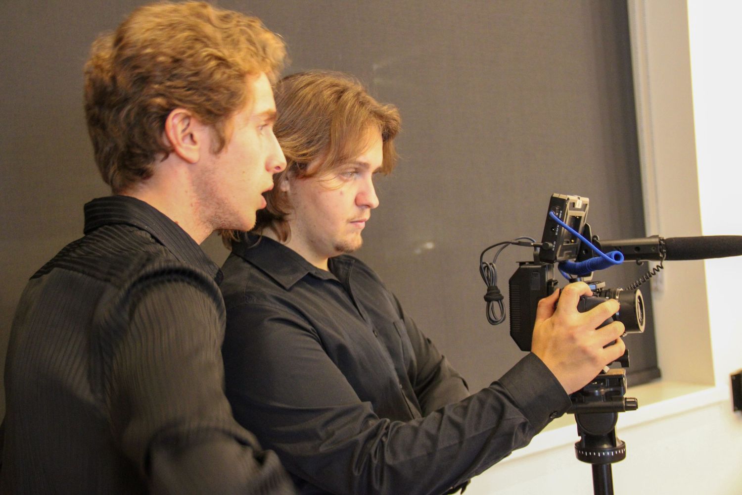 A photo of behind the scenes of a videography shoot.