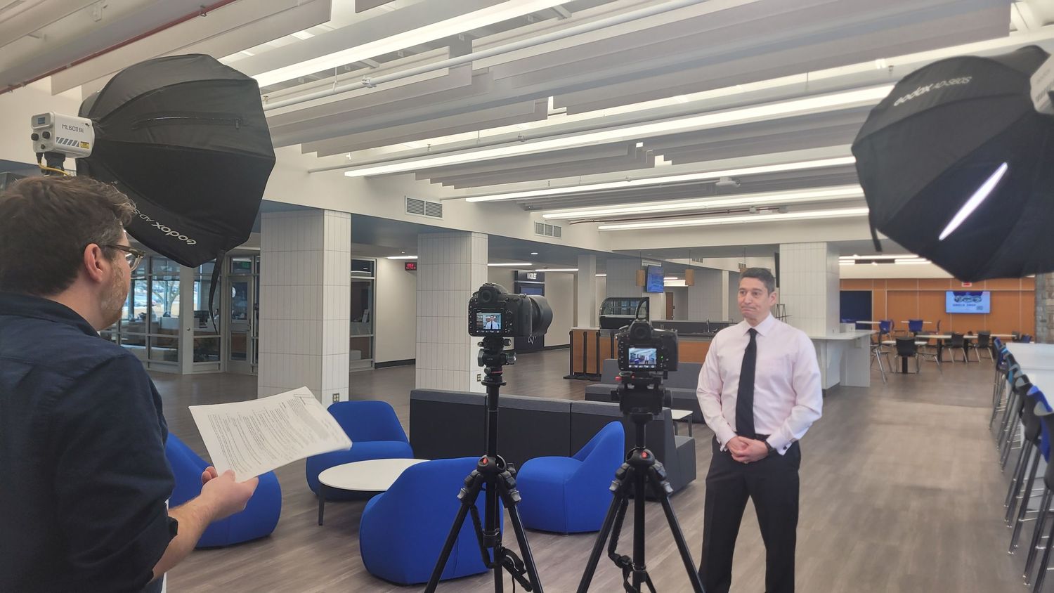 A photo of behind the scenes of a videography shoot.