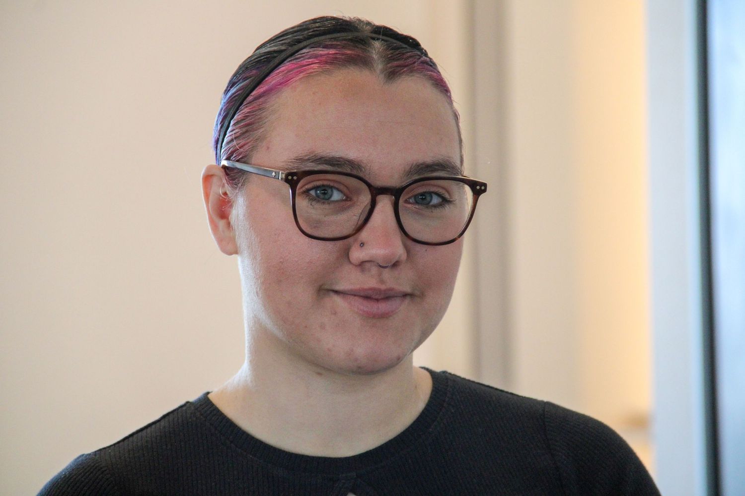 A woman smiling at a camera