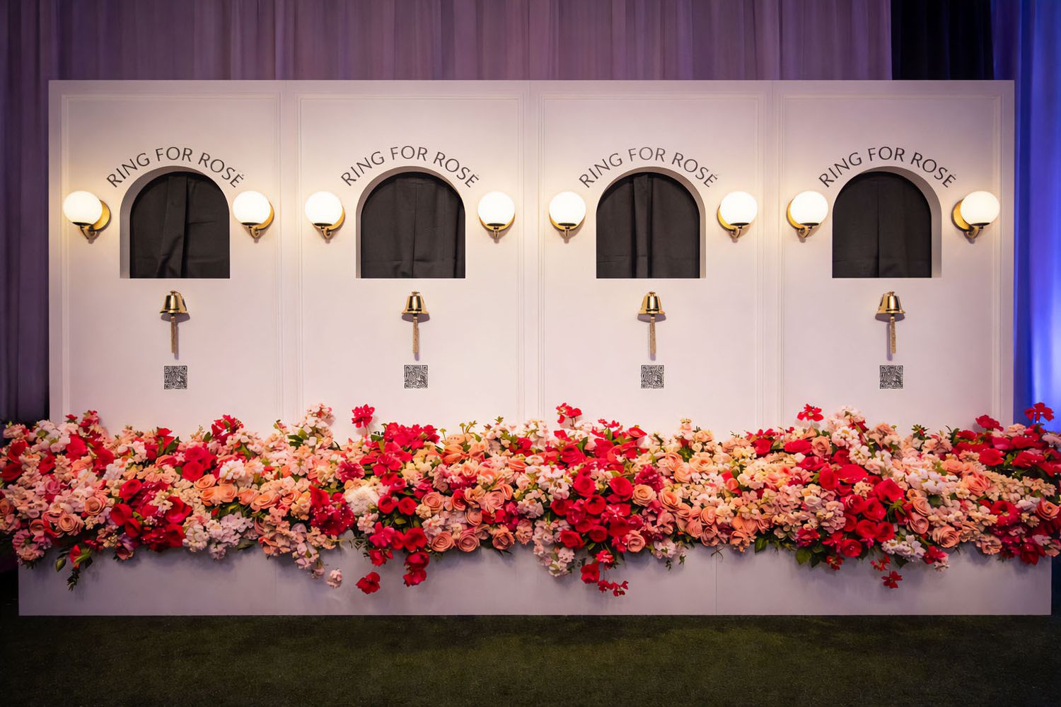 Mountain Productions image of an experiential activation, where guests walk up to a wall, a hand appears, offering a beverage,