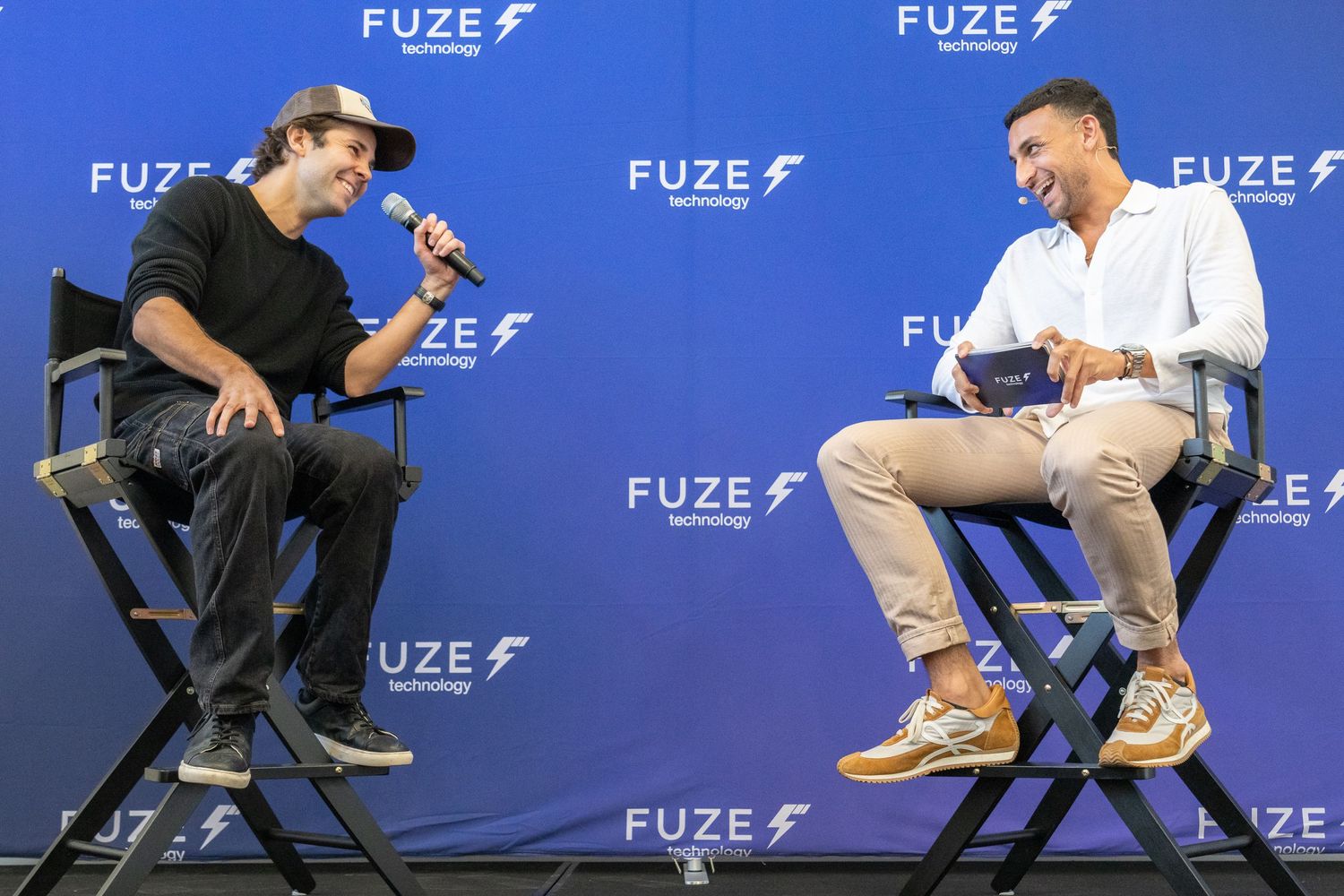 Mountain Productions image of a Corporate Panel discussion with both members of the panel laughing.