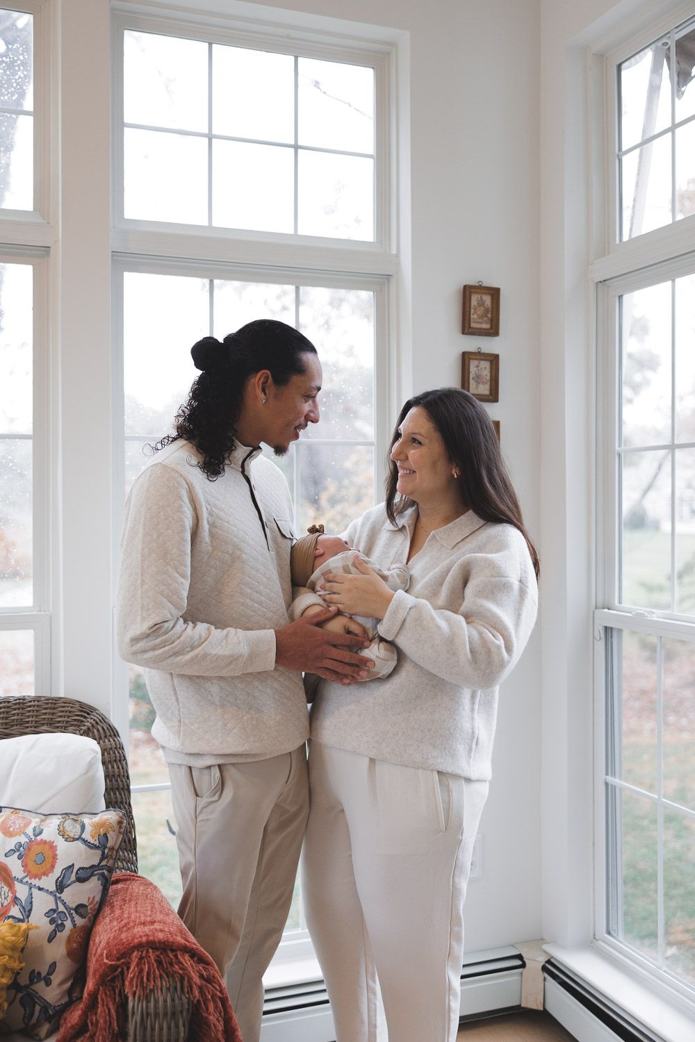 Parents and baby during in-home lifestyle newborn session in Camden County, NJ