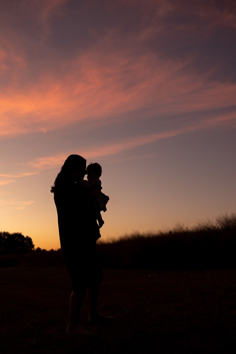 Mother and daughter silhouette during golden hour family session at Smithville Park, Burlington County, NJ by Rego Photography