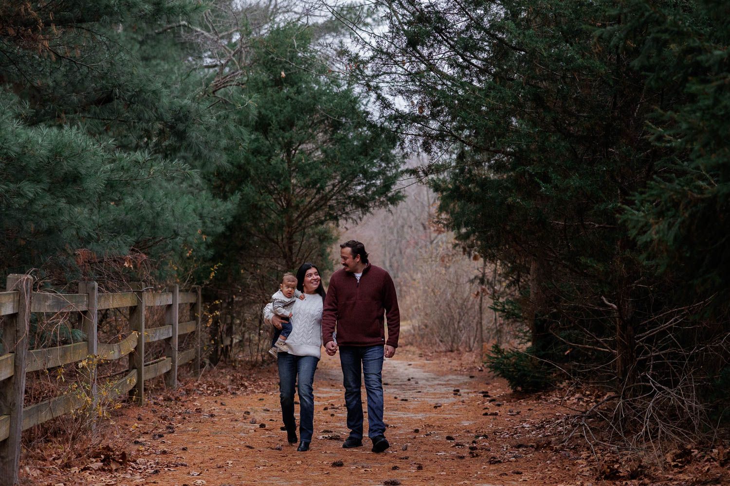 Family walking along wooded pathway at Boundary Creek Natural Resource Area in Moorestown, NJ