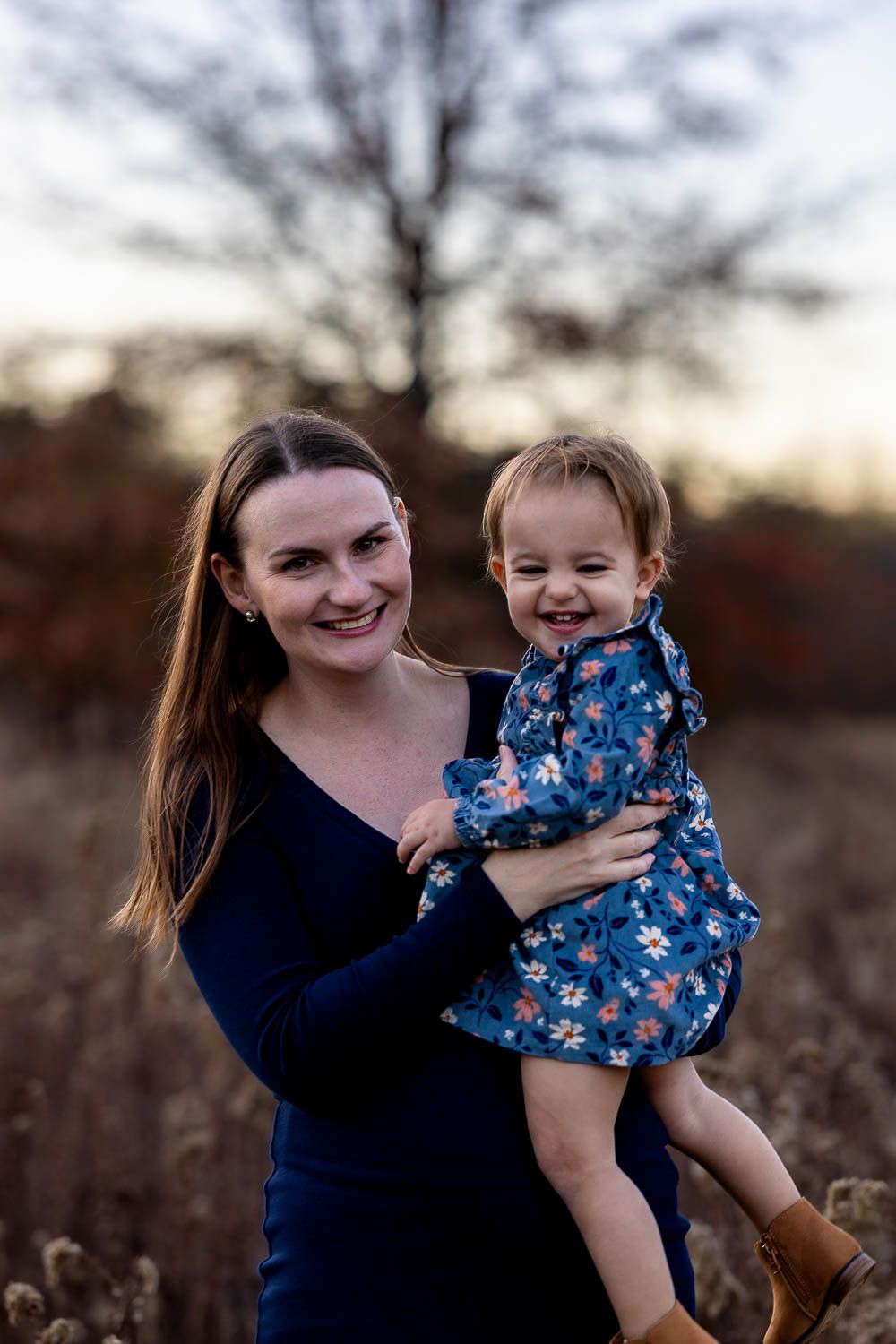 Mother and daughter during fall family photo session in field at Boundary Creek Natural Resource Area in Moorestown, NJ