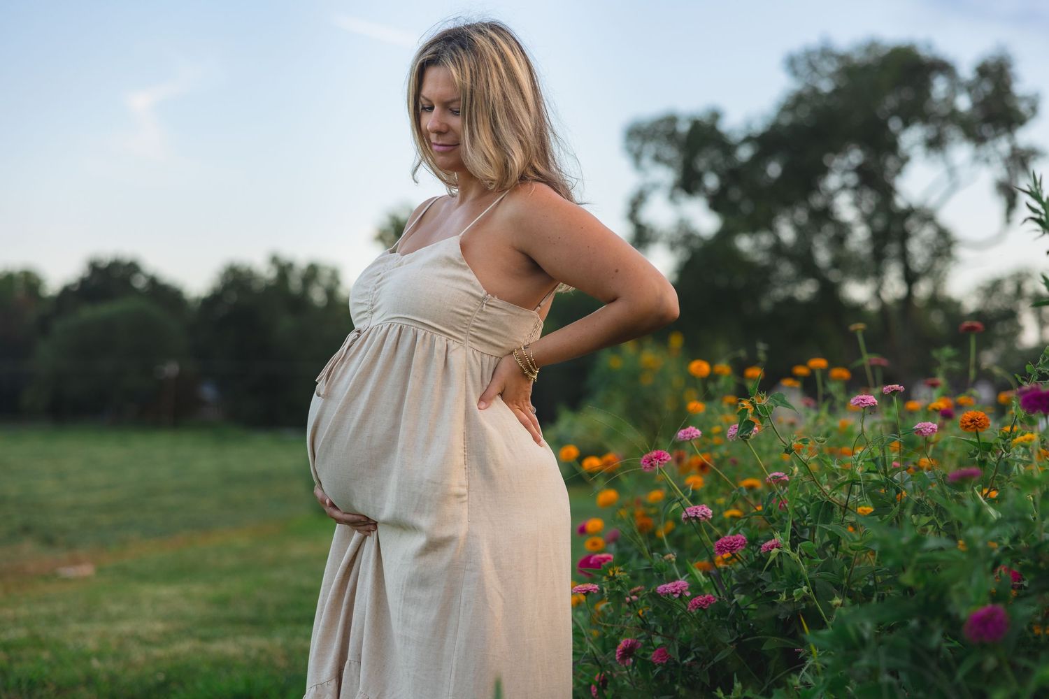 Maternity photography session in flower field during golden hour in Burlington County, New Jersey, by Rego Photography