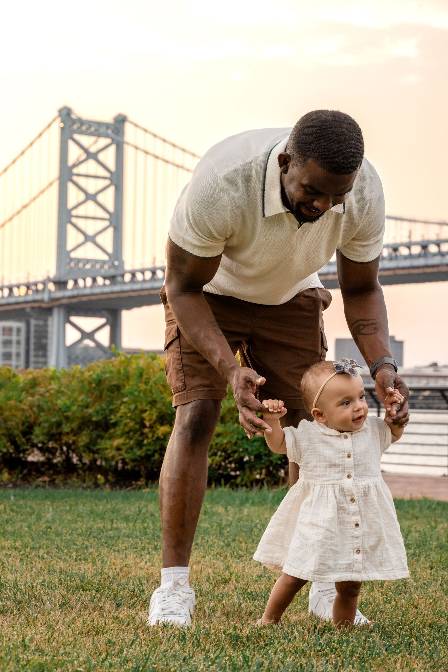 Dad and daughter playing at family photo session in Camden County, New Jersey, at waterfront park in Camden, by Rego Photography