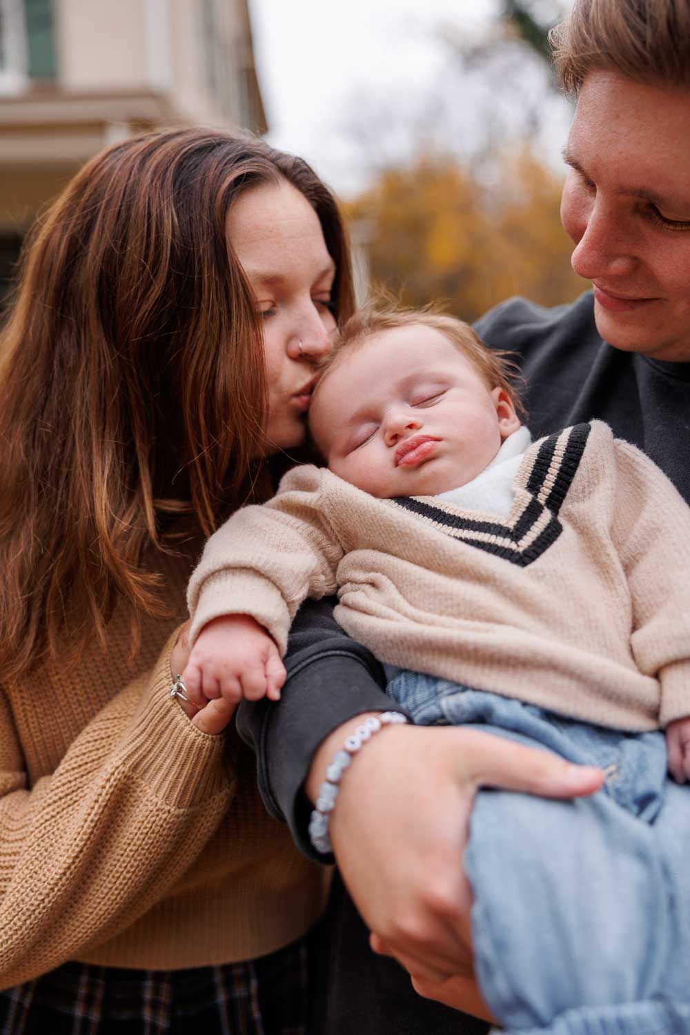 A tender moment captured in a series of intimate photos showing two people embracing in warm sweaters.