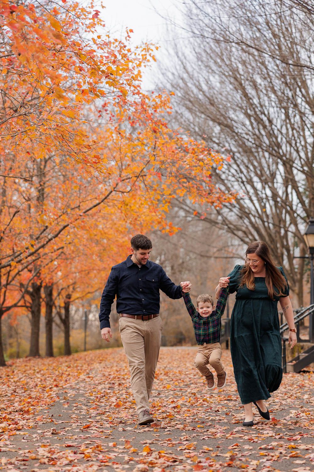 Fall family photo session with vibrant fall foliage at Smithville Park in Eastampton, NJ