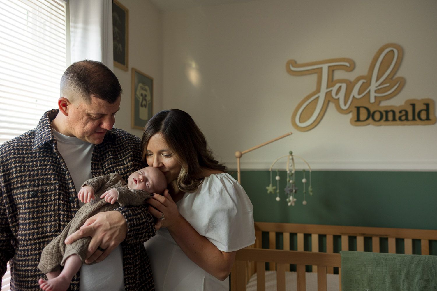 Parents and baby during in-home lifestyle newborn session in Cherry Hill, NJ