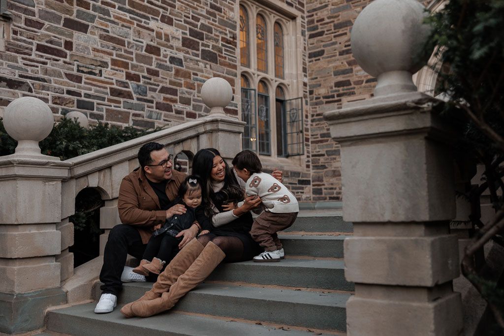 Family cuddling and laughing during family session in Princeton, NJ, by Rego Photography, family photographer