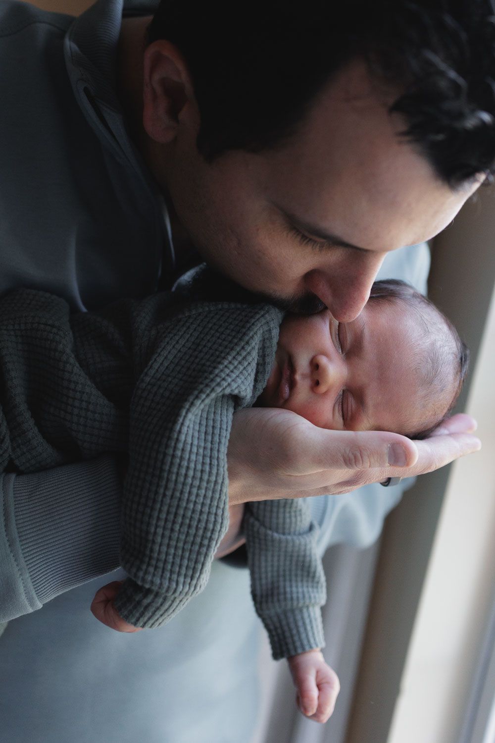 In-home lifestyle newborn photo session by newborn photographer, Rego Photography, in Collingswood, Camden County, New Jersey