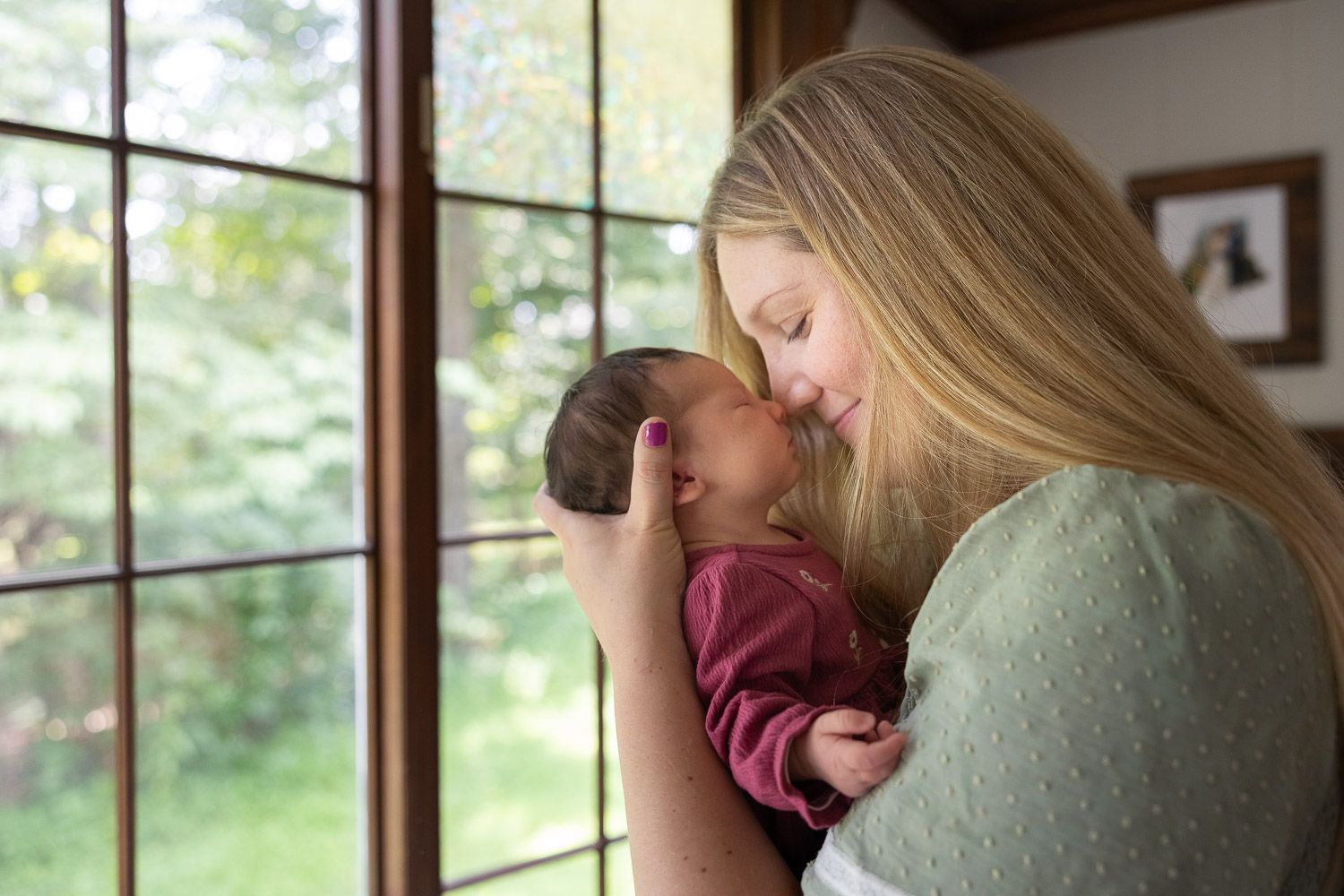 Mother and baby during in-home lifestyle newborn photo session in Burlington County, NJ