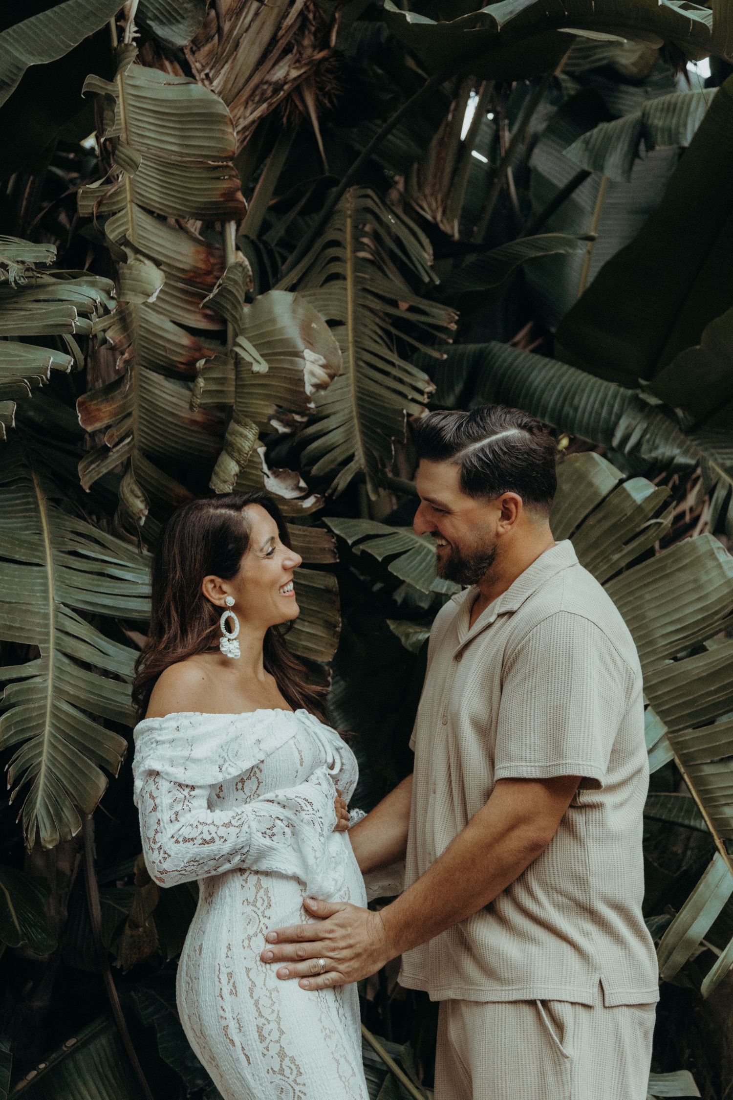 Intimate moment between expecting parents during a maternity photoshoot in Sicily