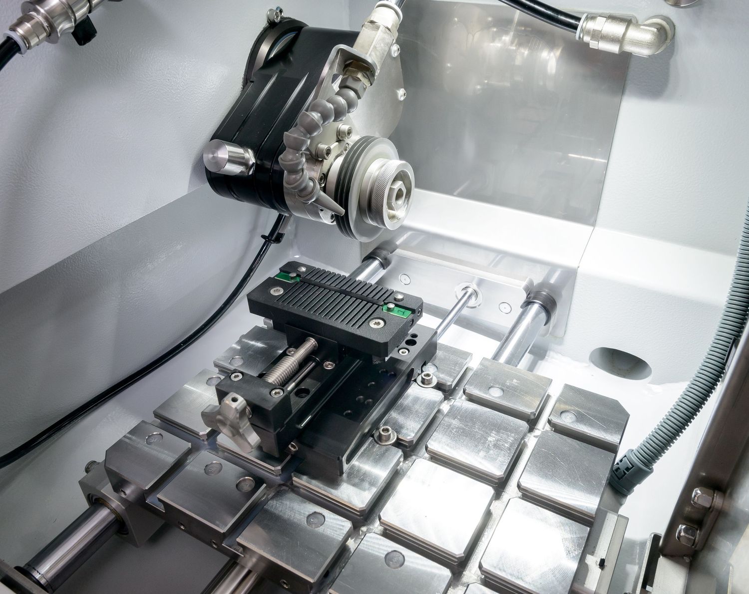 Close up of the inside of a precision cutting machine showing blades and base by stonehouse photographic.