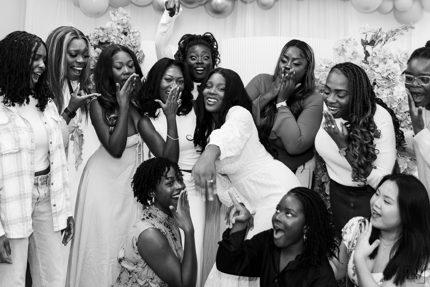 Black and white photo showing joyful reactions and celebrations at a special event.