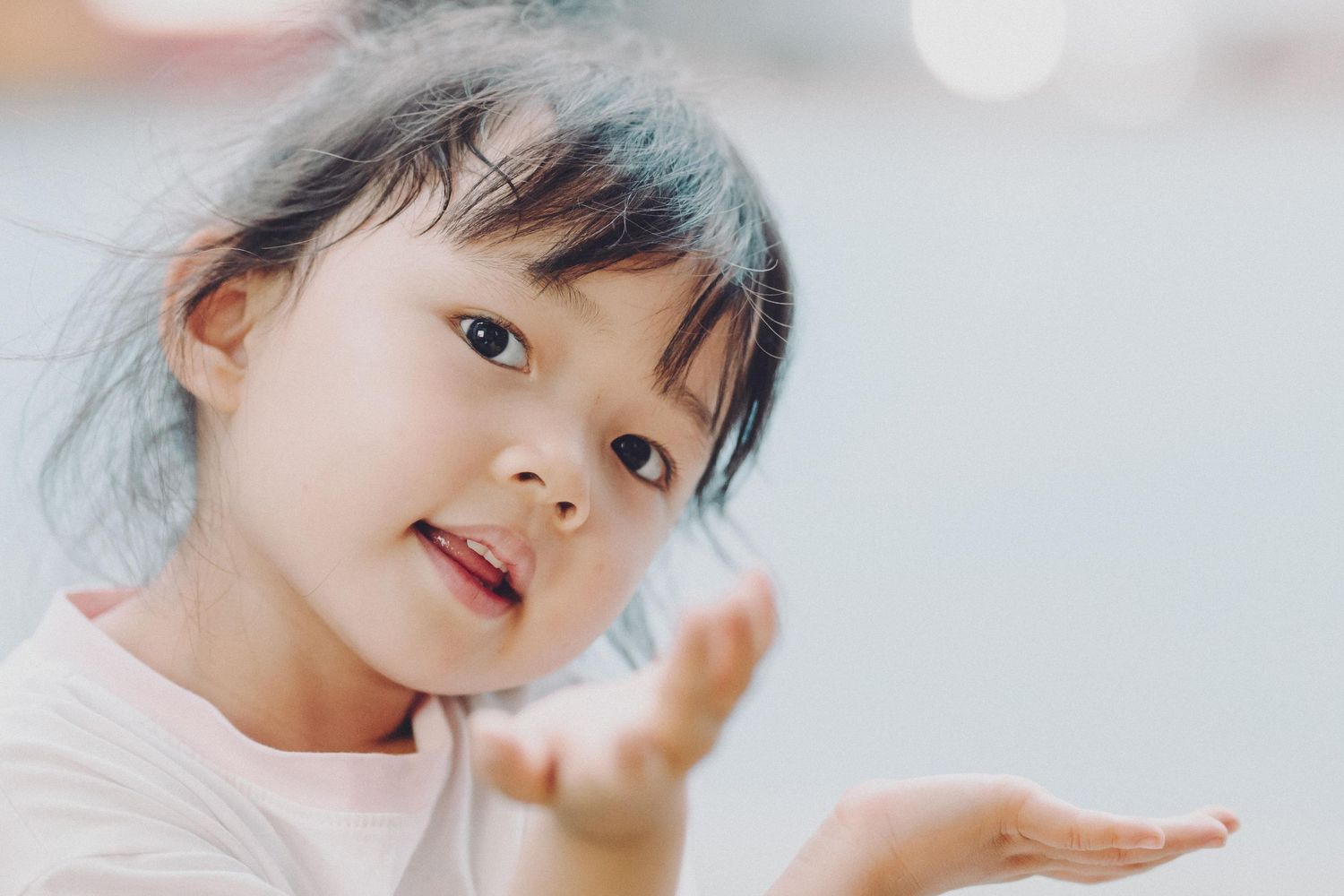 Young child making playful gestures against a soft blurred background. in melbourne