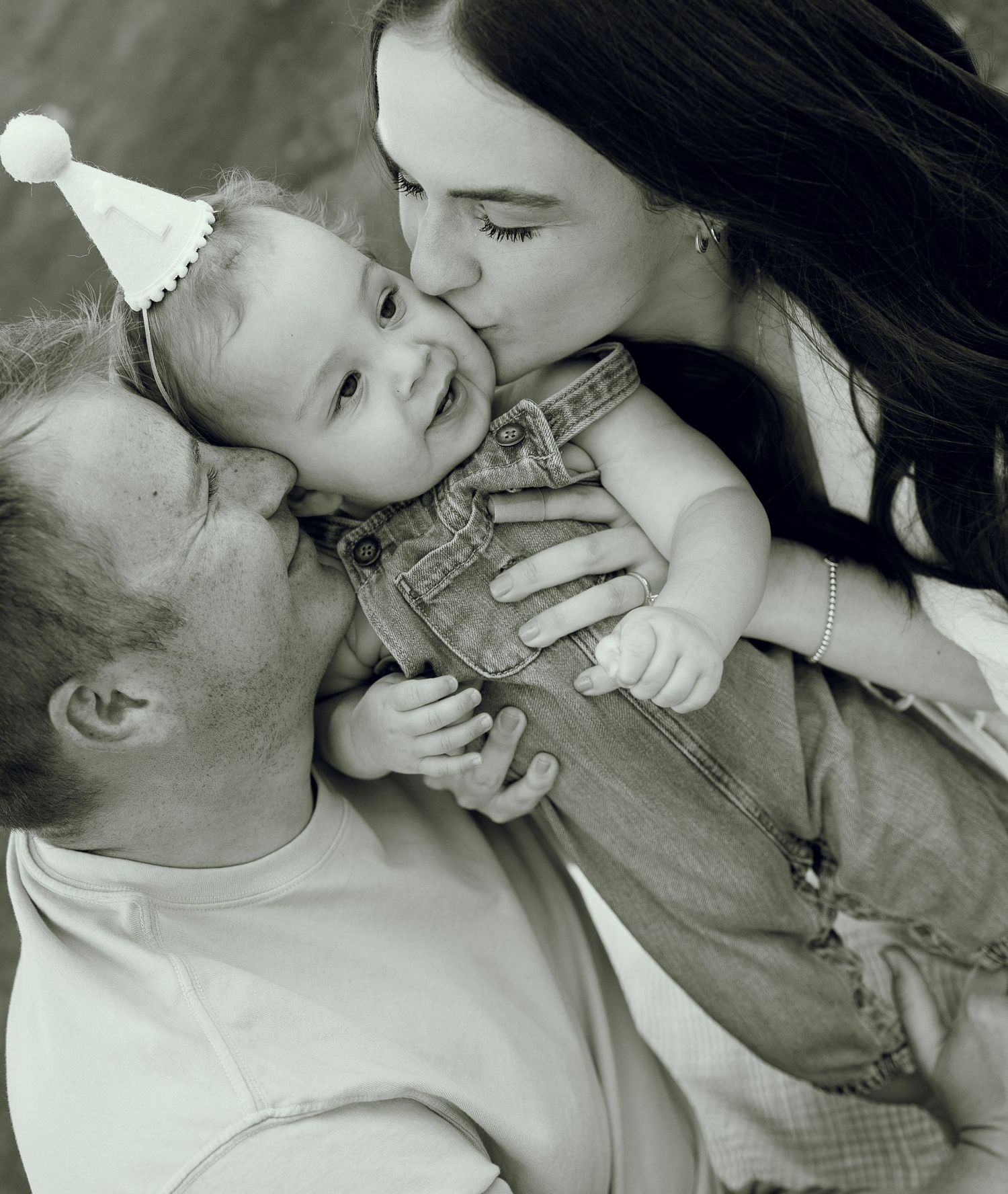 A romantic black and white photo collage showing tender moments of affection between a couple.