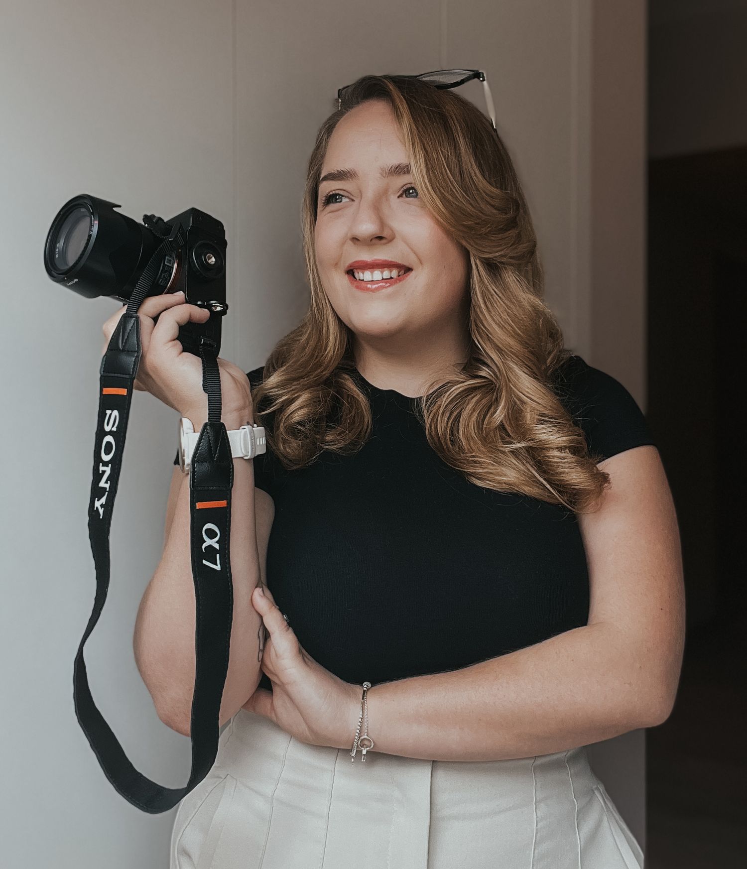 Self-portrait of Shayla Bloom holding her camera for business photography captured by Shayla Bloom Photography