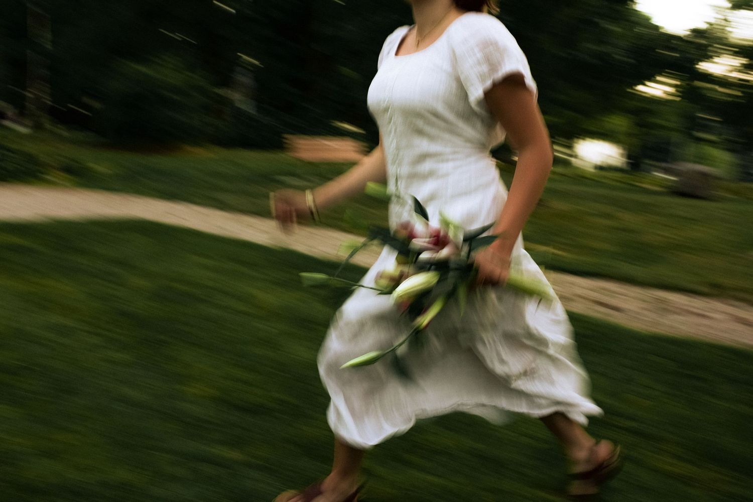 Kennedy running with bouquet of lilies