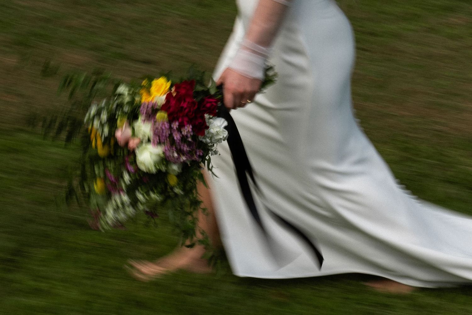 motion blur shot of bride holding bouquet