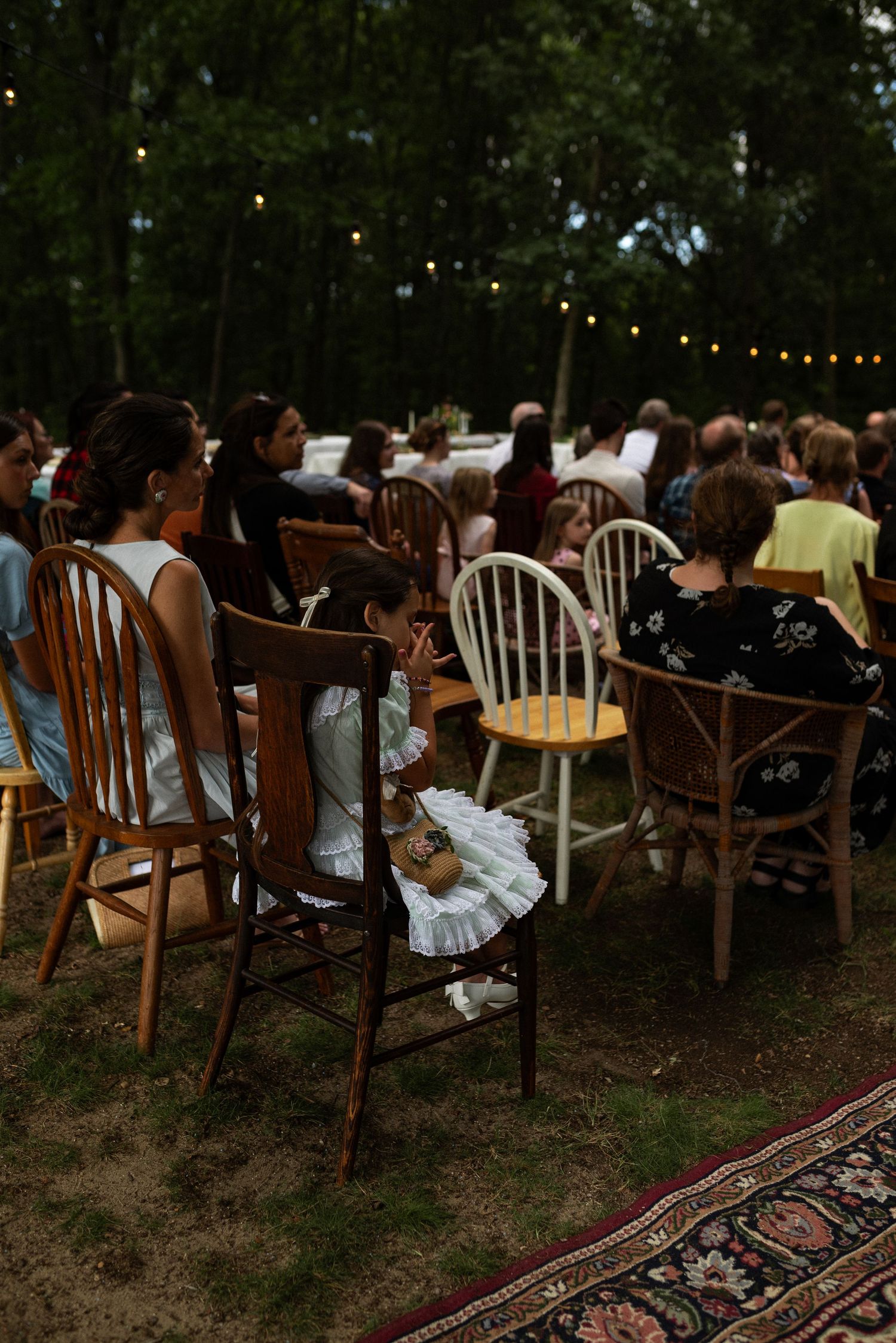 girl wiping tear at a wedding