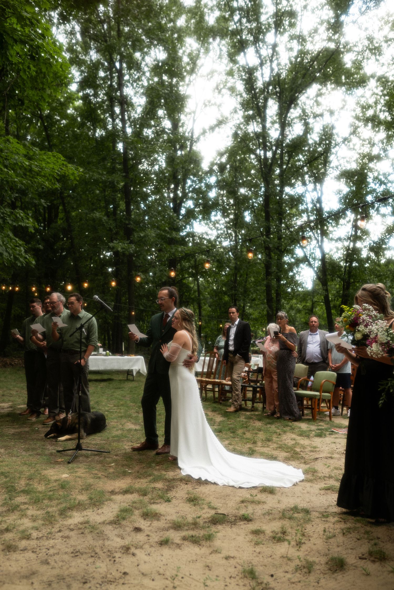 bride and groom worshiping Jesus through song at alter during wedding ceremony