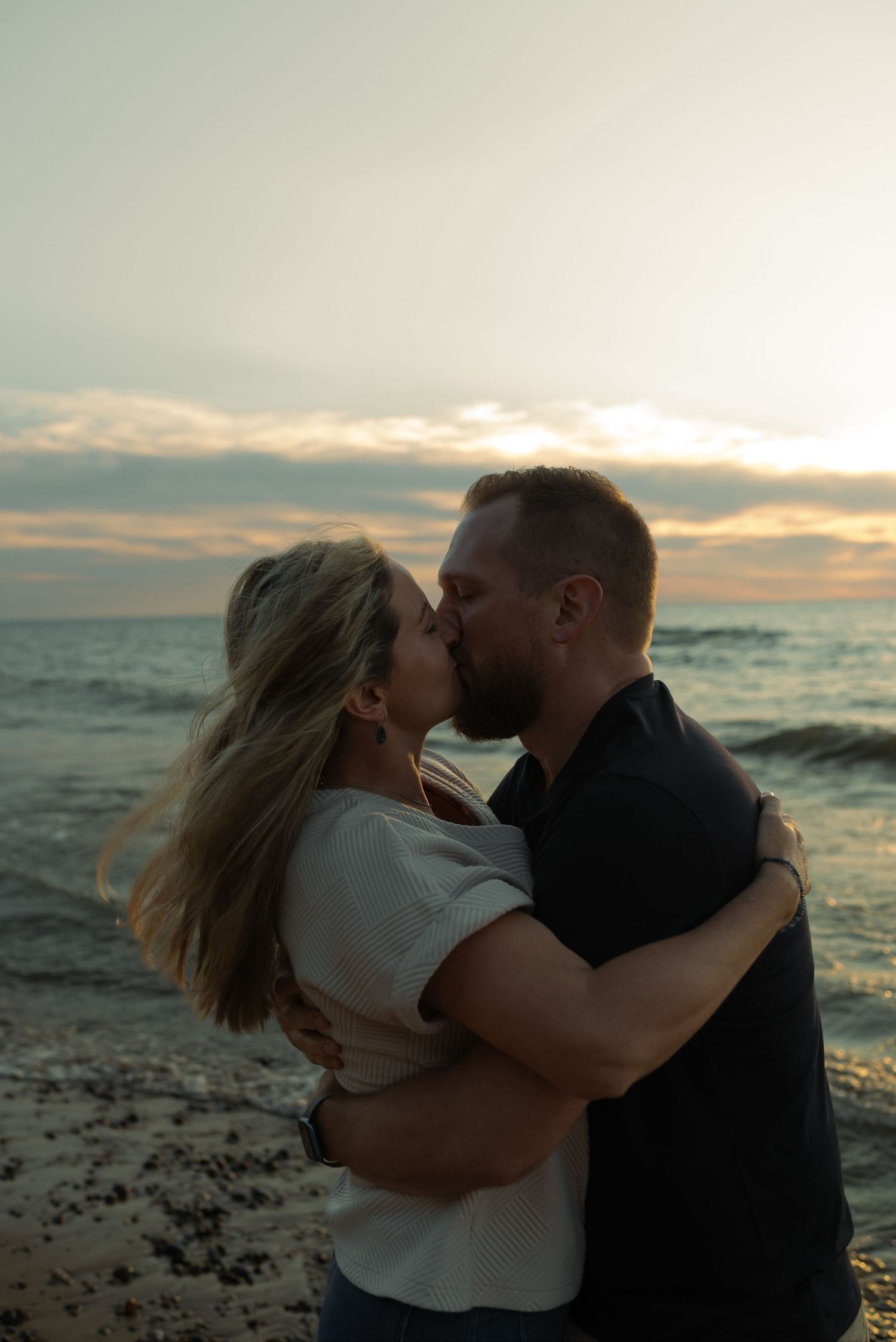 husband and wife kissing