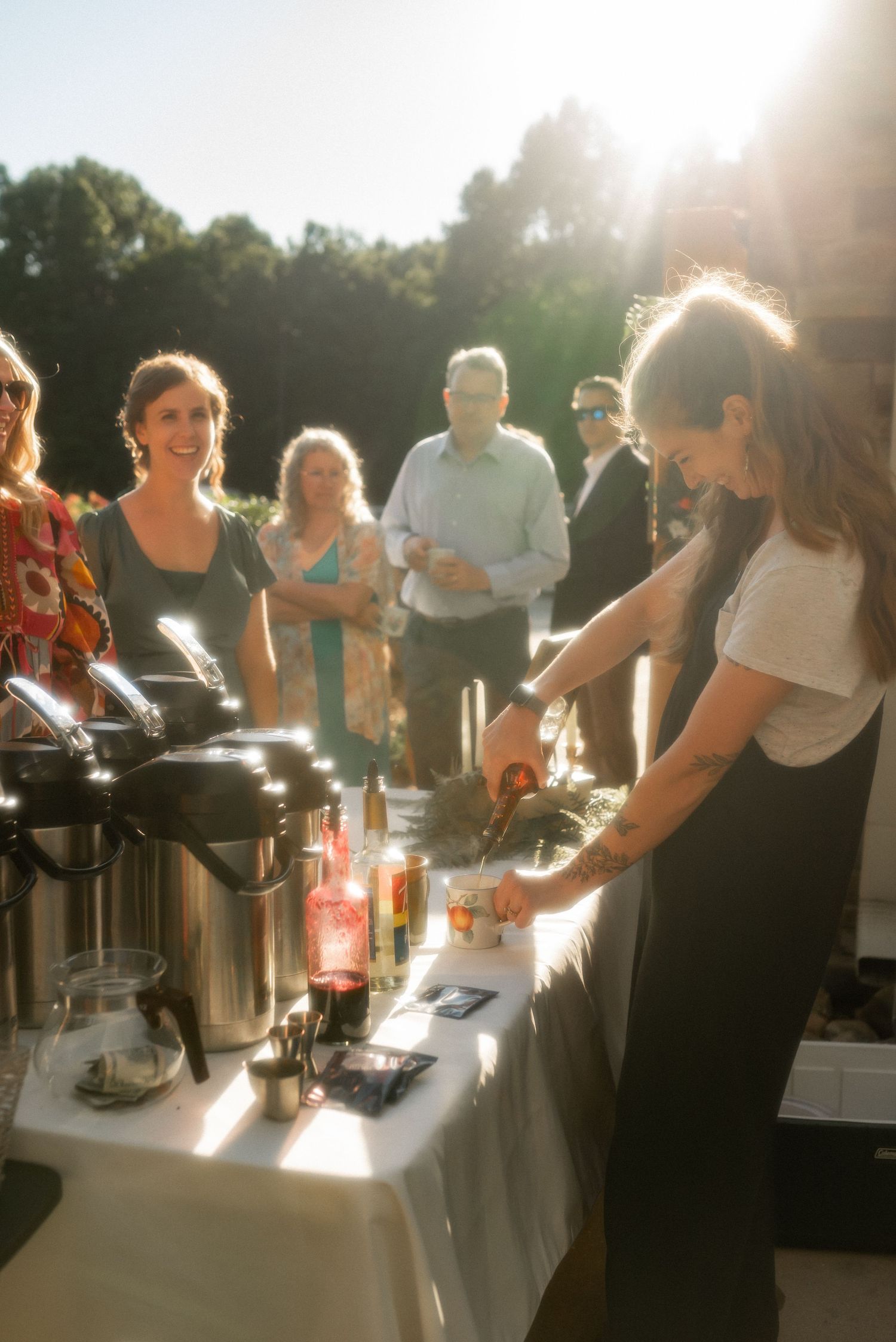 coffee shop wedding vendor pouring syrup into a coffee mug