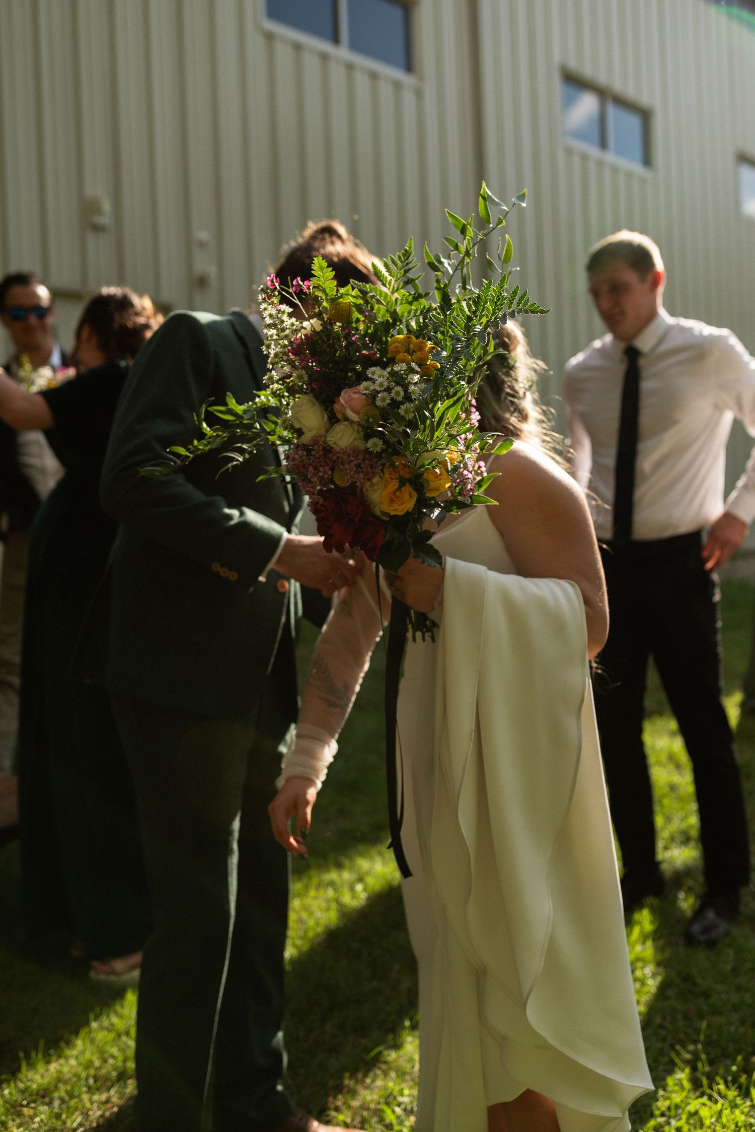 bride and groom talking to each other after wedding ceremony