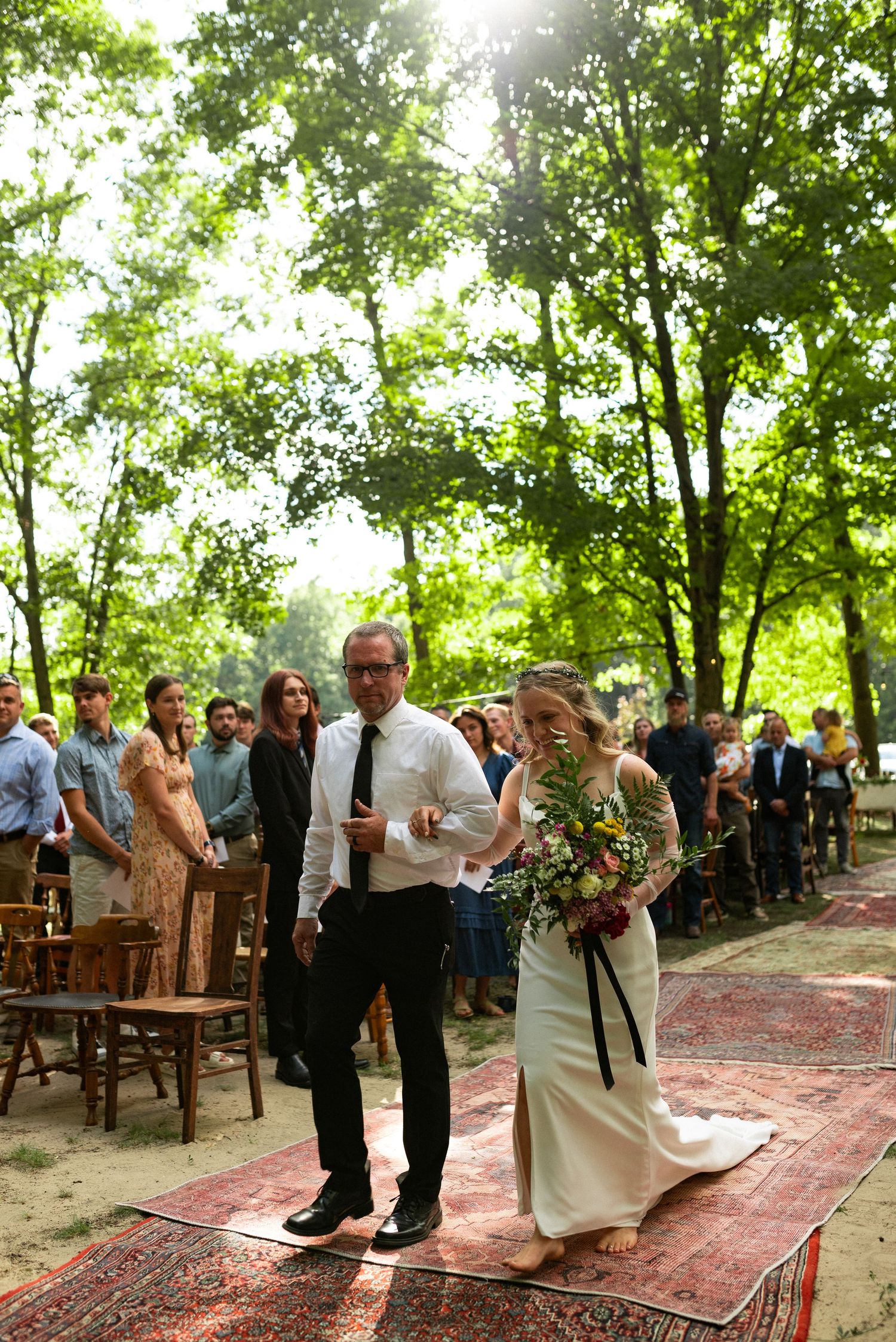 father walking bride down the aisle made from old rugs