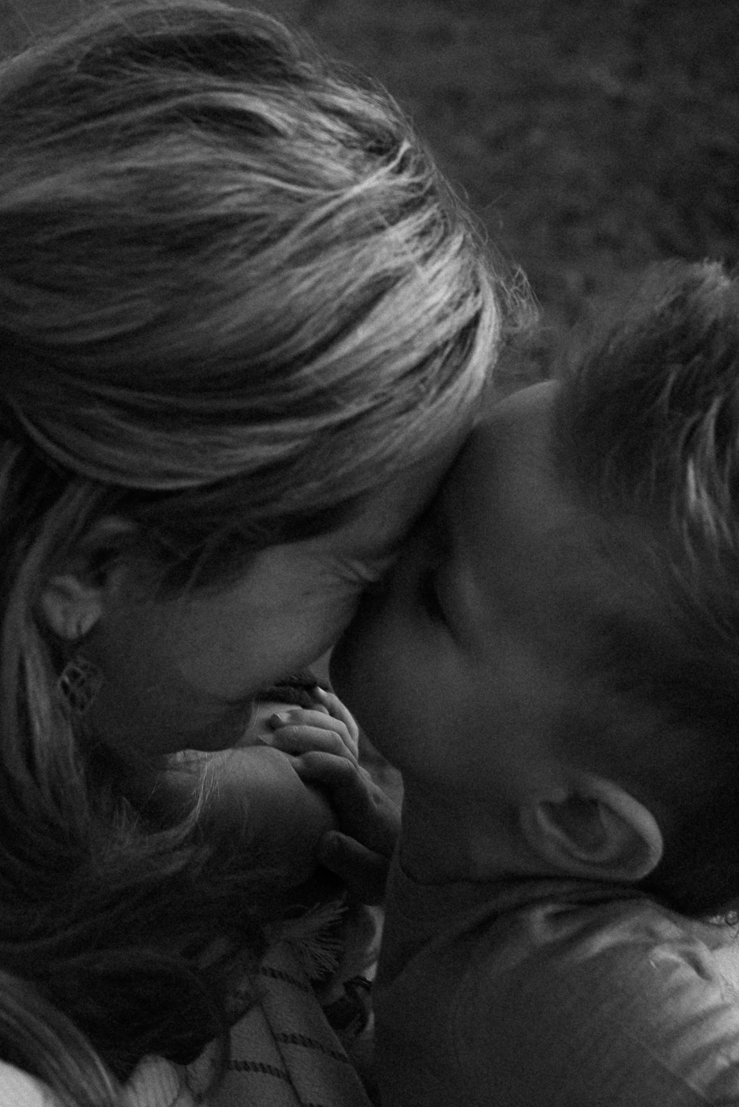 son kissing mom on forehead