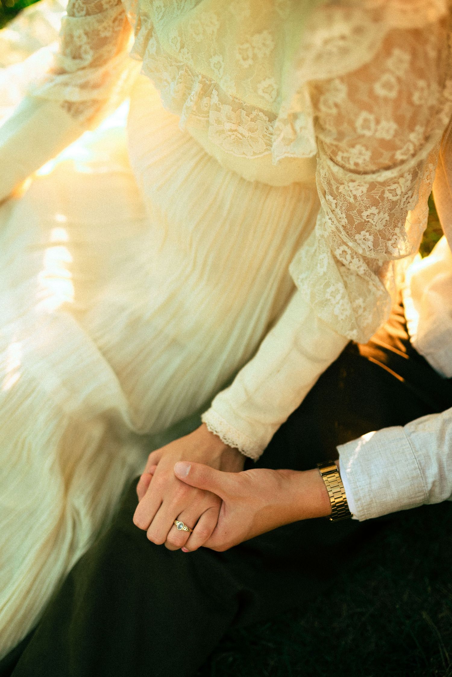 engaged couple sitting together, beautiful gunne sax dress and engagement ring