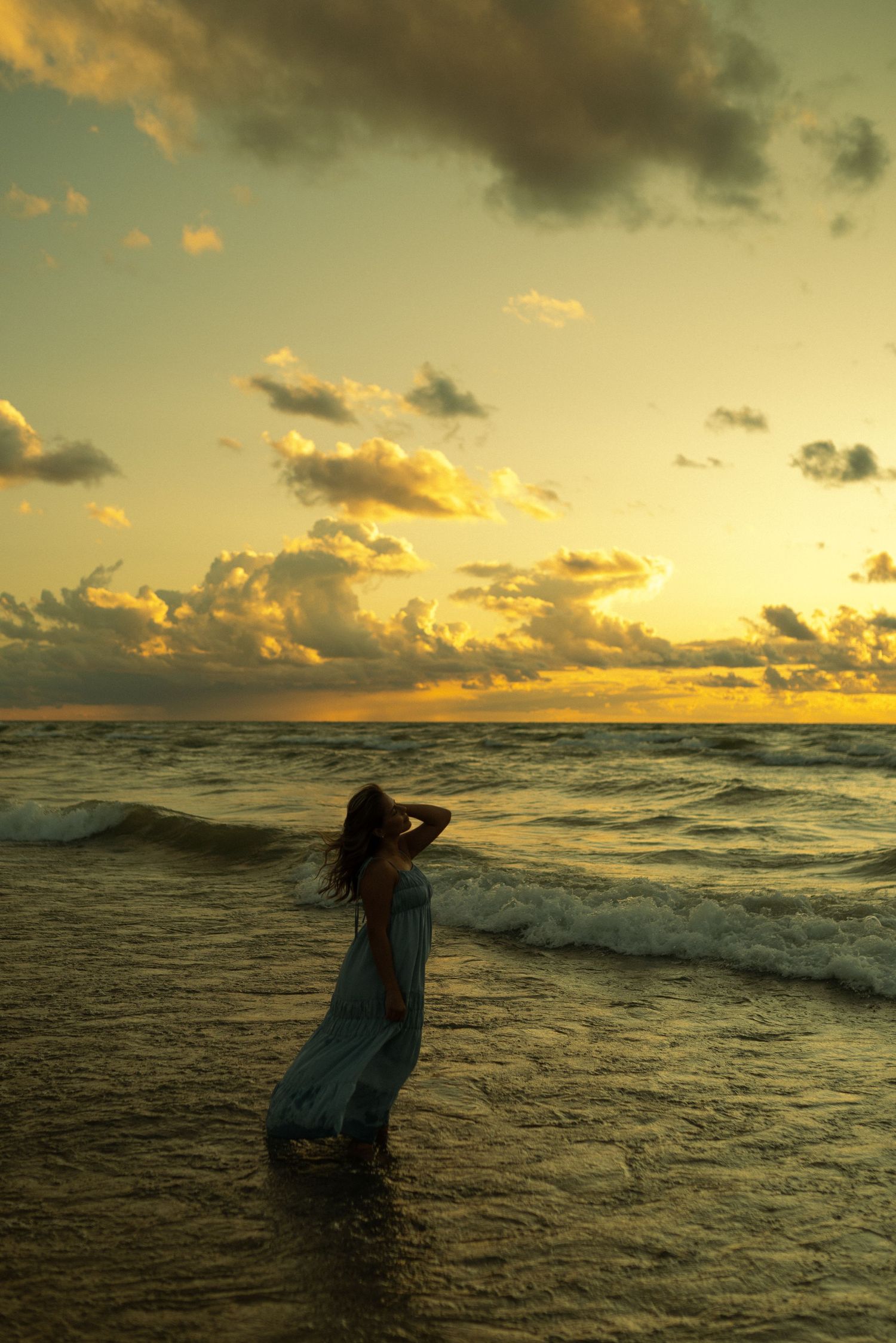 senior photo with stunning beach sunset