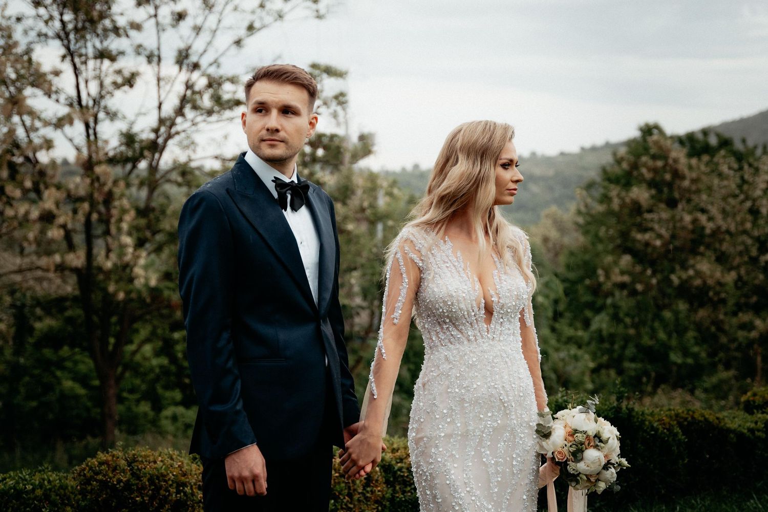 Scenic view of an outdoor wedding ceremony setup with floral decorations.