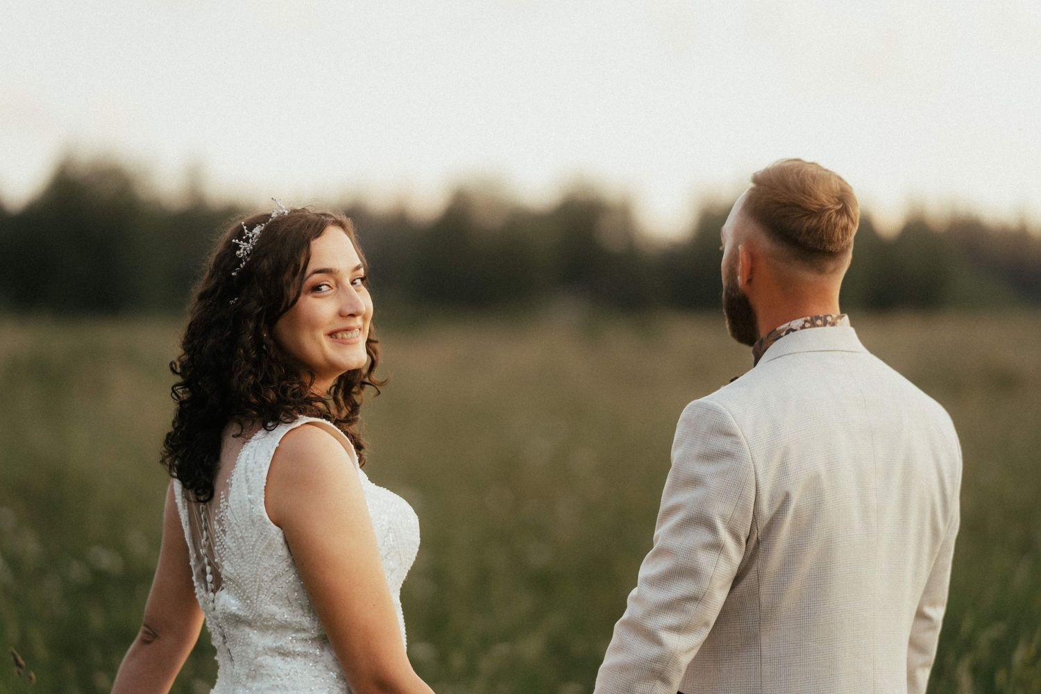 A mysterious look of a bride holding tight the groom